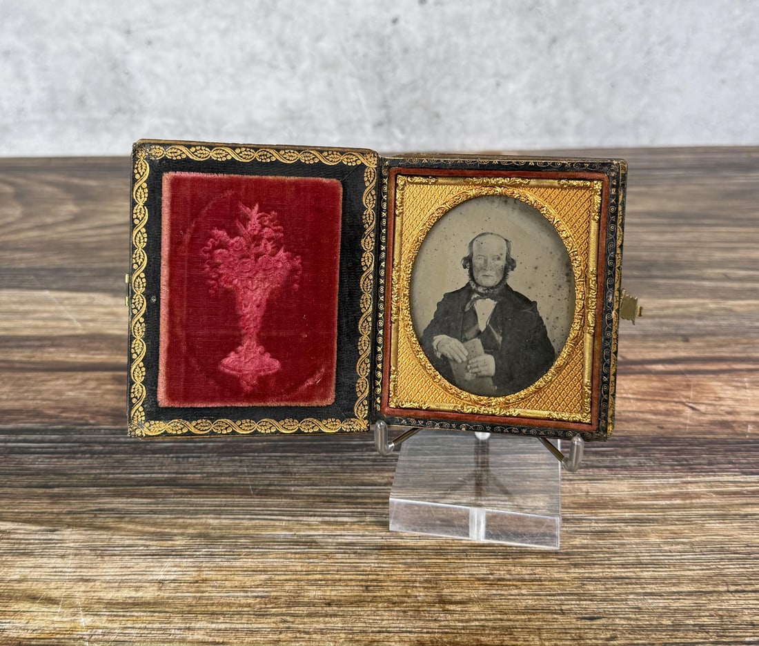 Kimsey Family Antique Ambrotype Photo: Man is Holding a Book, Has a Fancy Bowtie, a Beard, and an Unusual Hair Style. Mother of Pearl Inlaid Case. 3 1/2" by 4" cased.