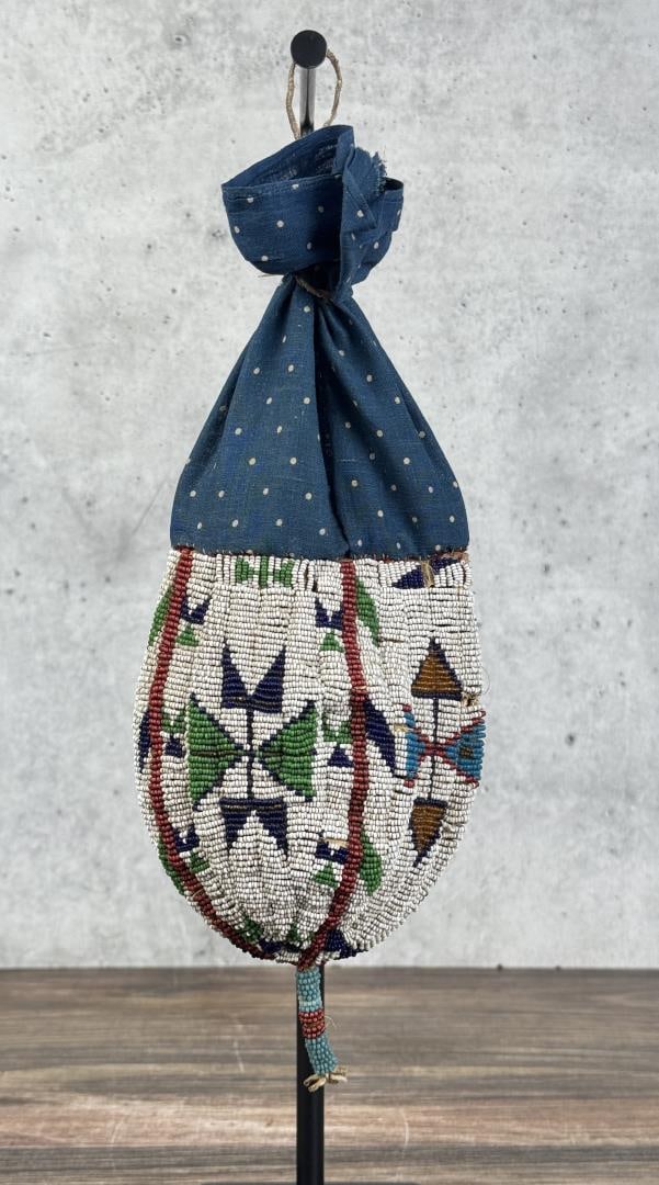Sioux Indian Beaded Buffalo Scrotum Medicine Bag: Calico trade cloth top. 12 1/4" long by 5 1/8" wide. Last Quarter of the 19th Century.