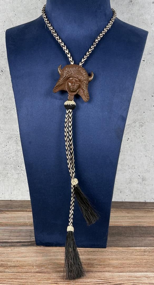 Allan Houser 1994 Prix de West Bronze Bolo Tie: Title is Buffalo Dancer of the Rio Grande Pueblo. 21" long on bolo. Allan Capron (Haozous) Houser (1914 - 1994) was active/lived in New Mexico, California. Allan Houser is known for Indian figure scul