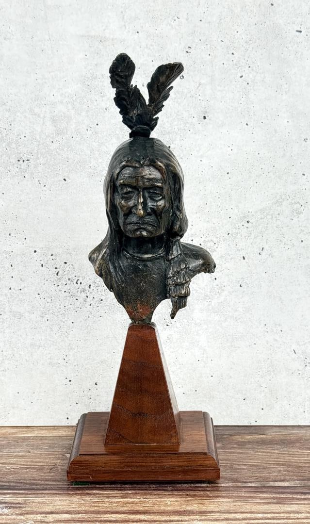 Olaf Wieghorst Indian Head Bronze: Title is Chief Bust. 10 1/2" by 4" by 4". Signed OW with a Buffalo Skull. Olaf Carl Wieghorst (1899 - 1988) was active/lived in California / Denmark. Olaf Wieghorst is known for Western-Indian-genre, 