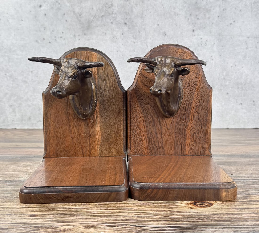 Charles M Russell Steer Head Bronze Bookends: Each is 7 7/8" by 7" by 5 1/2". Charles Marion Russell (1864 - 1926) was active/lived in Montana, California, Missouri. Charles Russell is known for Indian-frontier genre painting, sculpture. Charles 