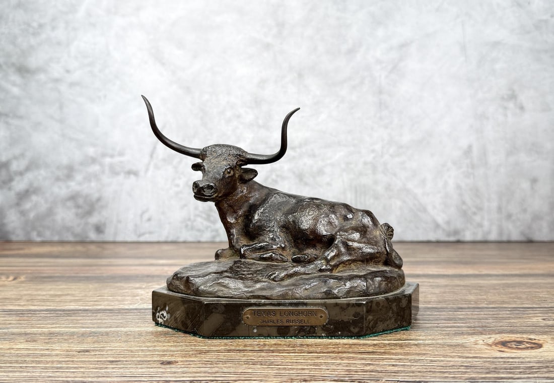 Charles M Russell Texas Longhorn Bronze: Cast by Harry Jackson from his plaster model originally made by Russell. Bronze is numbered 64. The steer is branded FB for Frank Bogart. Scarce example that does not come up for sale very often. One