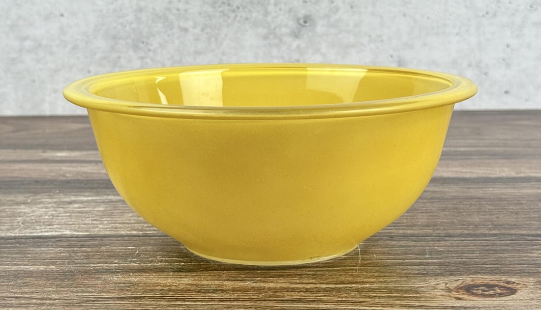 Pyrex Rainbow Yellow Mixing Bowl: 8 3/8" round by 3 3/8" deep.