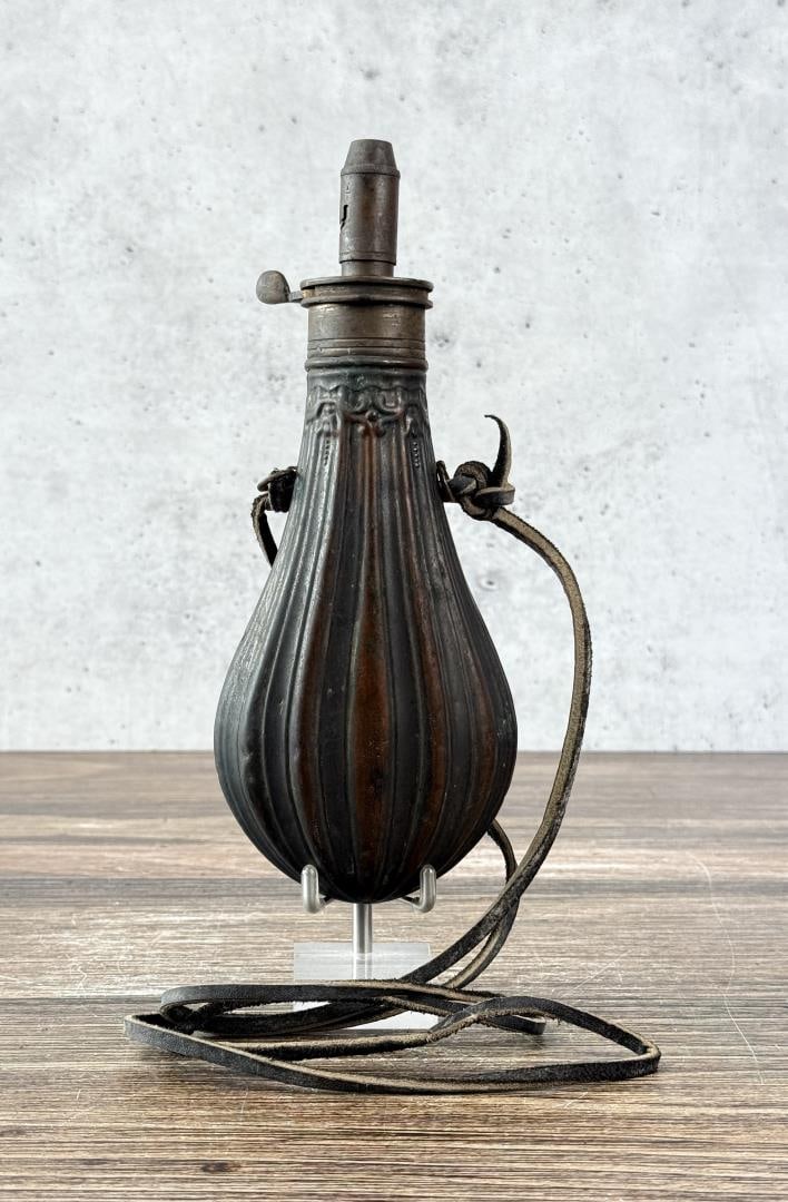 American Flask & Cap Civil War Powder Flask: 8 3/8" long by 3 1/4" wide at base.