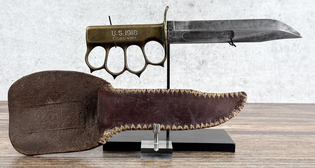 WW2 Theater Made Knuckle Duster Fighting Knife: This is a marriage of a WW1 knuckle knife handle and a Camillus USMC Mark 2 fighting knife blade. Notice the orientation of the blade. 11 1/8" long overall.