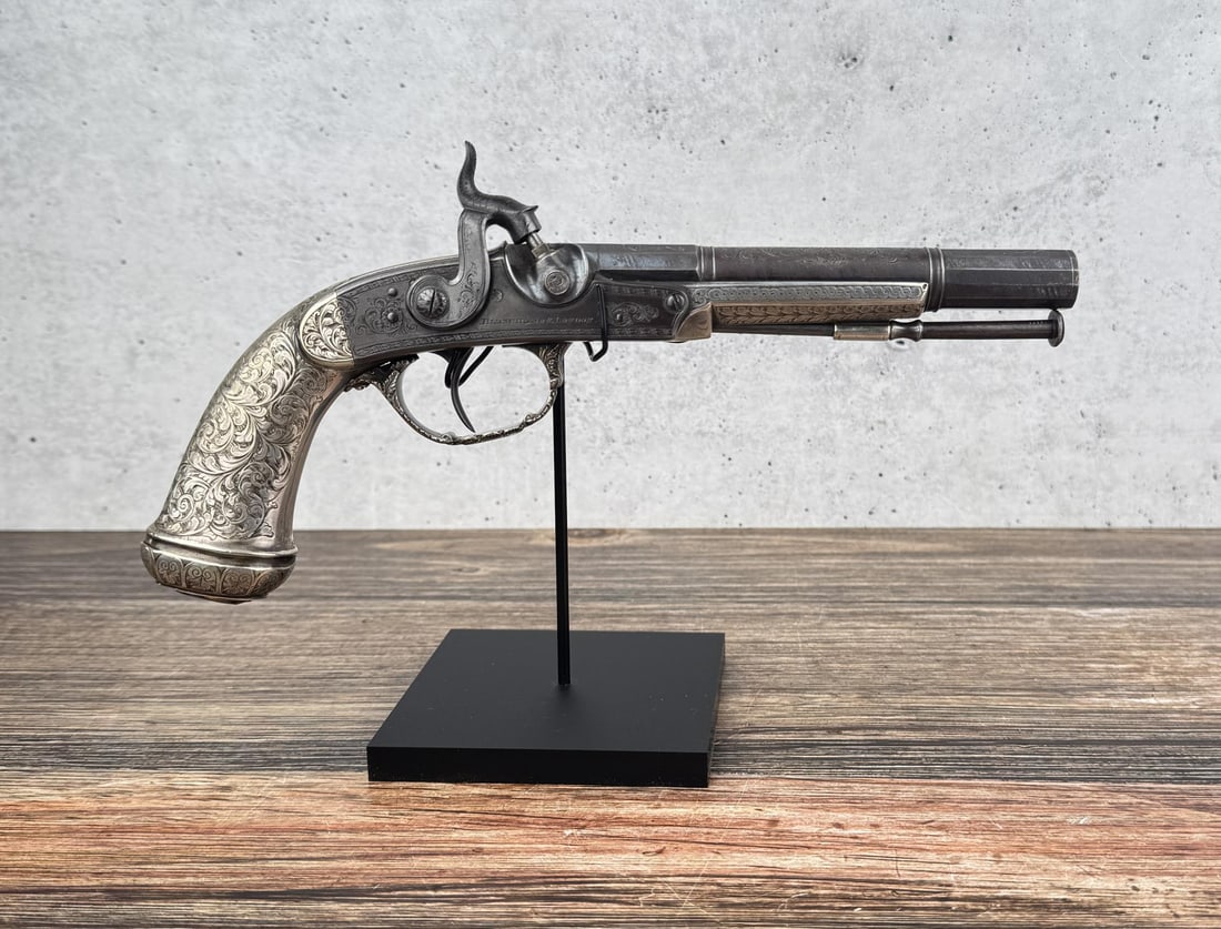 John Blanch & Son Scottish Silver Mounted Pistol: .465 caliber. Sterling Silver Fittings, set with a Cairngorm, which is sadly chipped. Barrel is blued with Silver Inlay. Blanch & Son, operated circa 1848-1899 as a partnership between John Blanch, wh