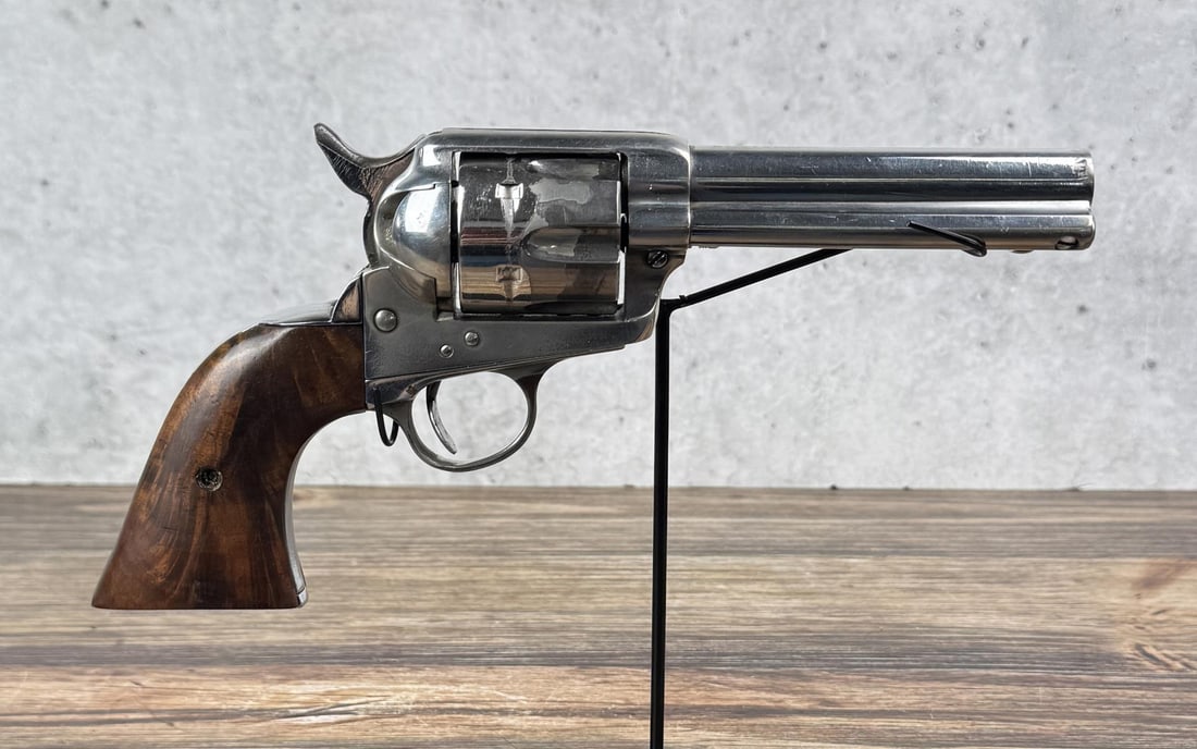 Colt Single Action Army .45 LC Gunfighter Revolver: Very interesting old gun. Nickel plated, with a large amount of plating remaining. Front sight has been removed, trigger and trigger guard have been altered for hip fire gunfighter use. 4 3/4" barrel.