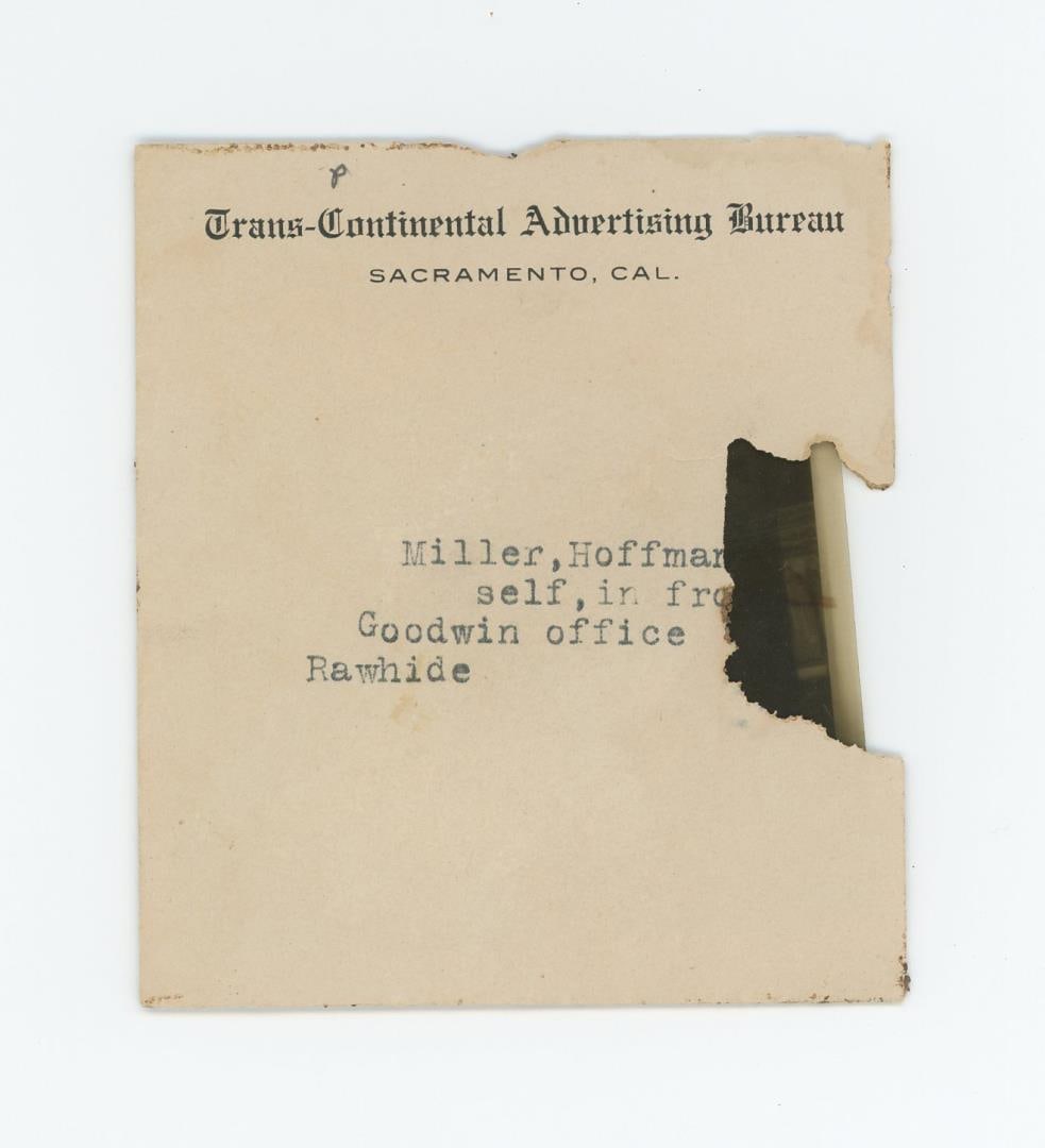 Rawhide Nevada Ghost Town Photo Negative: Titled Miller, Hoffman, and self in front of Goodwin office. Rawhide. 2 7/8" by 2 1/4" In December 1906, prospector Jim Swanson made a discovery of a rich gold and silver deposit in the hills near wha