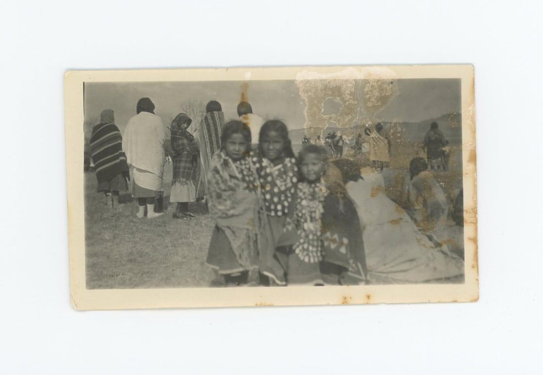 Crow Indian Girls in Elk Tooth Dresses Photo: 2 1/2" by 4 1/2". Provenance: Aline Natalie Burgess Claremont Los Angeles, daughter of James Gregor Burgess builder of the Burgess Baptist Church Crow Agency Montana, through Decent.