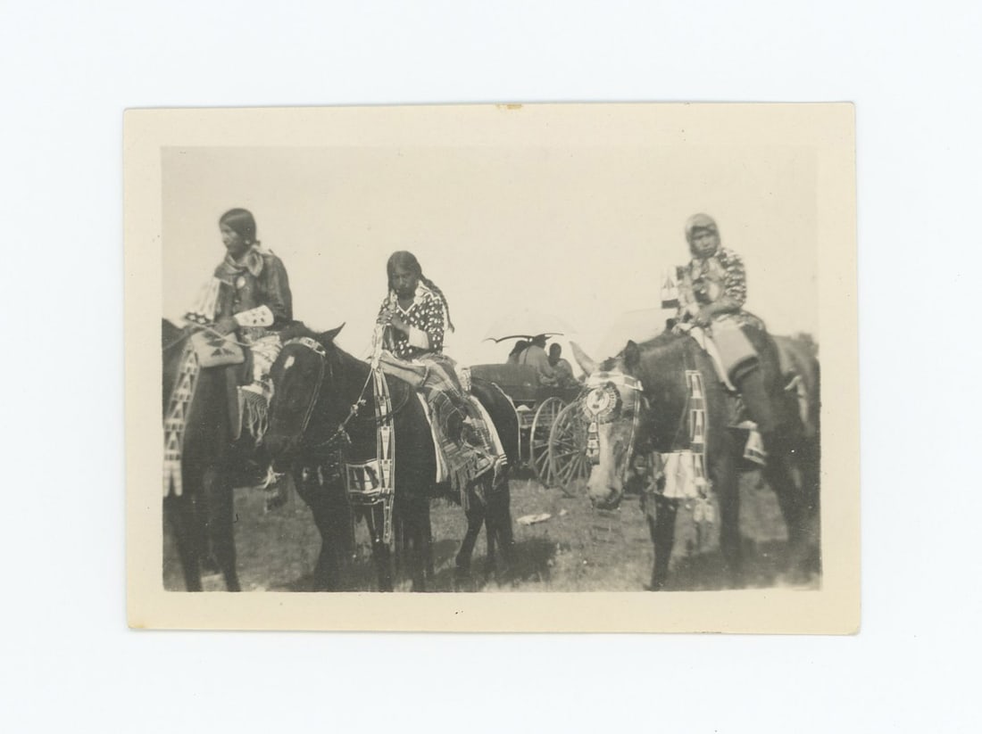 Crow Girls in Elk Tooth Dresses Montana Photo: Title on Back: Note the Elk teeth on the girls dresses and the horse trappings. 2 1/2" by 3 1/2" Provenance: Aline Natalie Burgess Claremont Los Angeles, daughter of James Gregor Burgess builder of th
