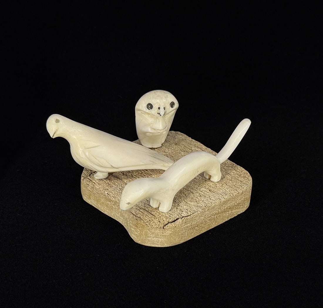 Mark Tungilik Repulse Bay Inuit Eskimo Carvings: 3 3/8" by 3 1/4" by 1 3/4". Carved Walrus Ivory and Whale Bone. Native made prior to 1972. This item cannot be shipped to Oregon, California, Hawaii, New York, New Jersey, Internationally, or any othe