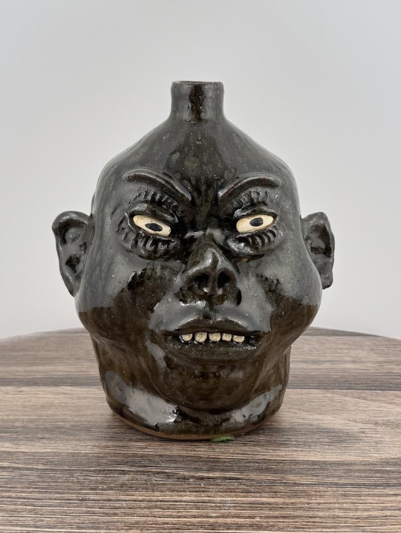 Lanier Meaders Pearly White Smile Face Jug: 10" by 7 3/4" by 7 1/2" Lanier Meaders (1917 - 1998) was active/lived in Georgia. Lanier Meaders is known for Folk art.