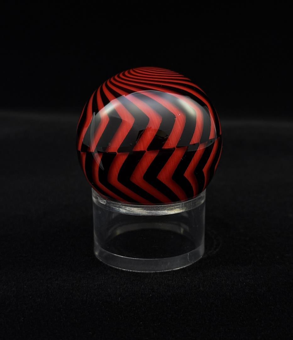 Mark Matthews Danger Ball Terentella Marble: 2" diameter. Signed and dated Matthews 2009. Hazard Pattern. A few small bruises as shown. Mark Matthews is notably recognized for his work in glass, especially in glass spheres. Working with only one