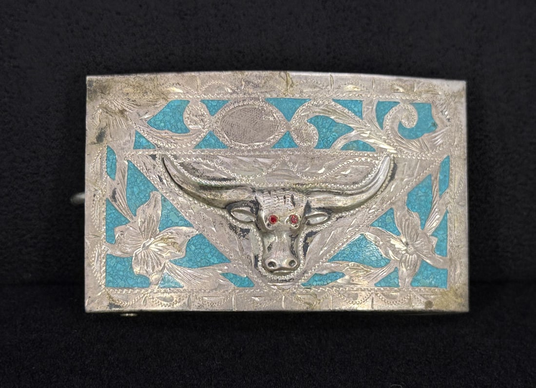 Sterling Turquoise Inlaid Cowboy Belt Buckle: Steer Head with Ruby Eyes. Made in Taxco Mexico. 70.66 grams. 3 1/4" long.