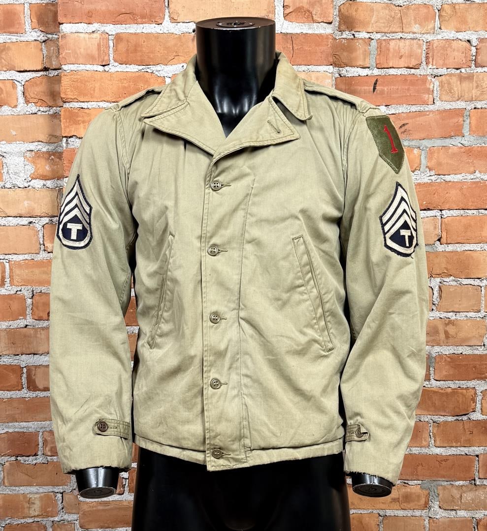 WW2 1st Infantry US Army M41 Arctic Field Jacket: 1st Infantry Division patch. Technical Sergeant rank. 20" across the chest by 23" long.