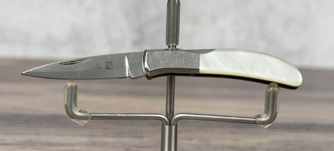 Al Mar 1002 P Hawk Japanese SEKI Pocket Knife: Mother of pearl handle. Measures 3 3/5" opened length.