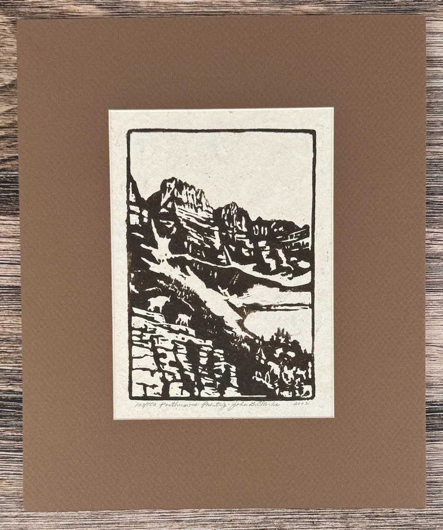 John Louis Clarke Glacier Park Montana Linocut: Title is Rocky Mountain Goat on the Garden Wall, Glacier National Park, Montana. 13 5/8" by 11 1/4" matted. 103 of 150. John Louis (Cutapuis) Clarke (1881 - 1970) was active/lived in Montana, Wisconsi