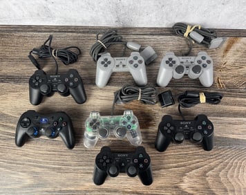 Group Of Playstation Video Game Controllers