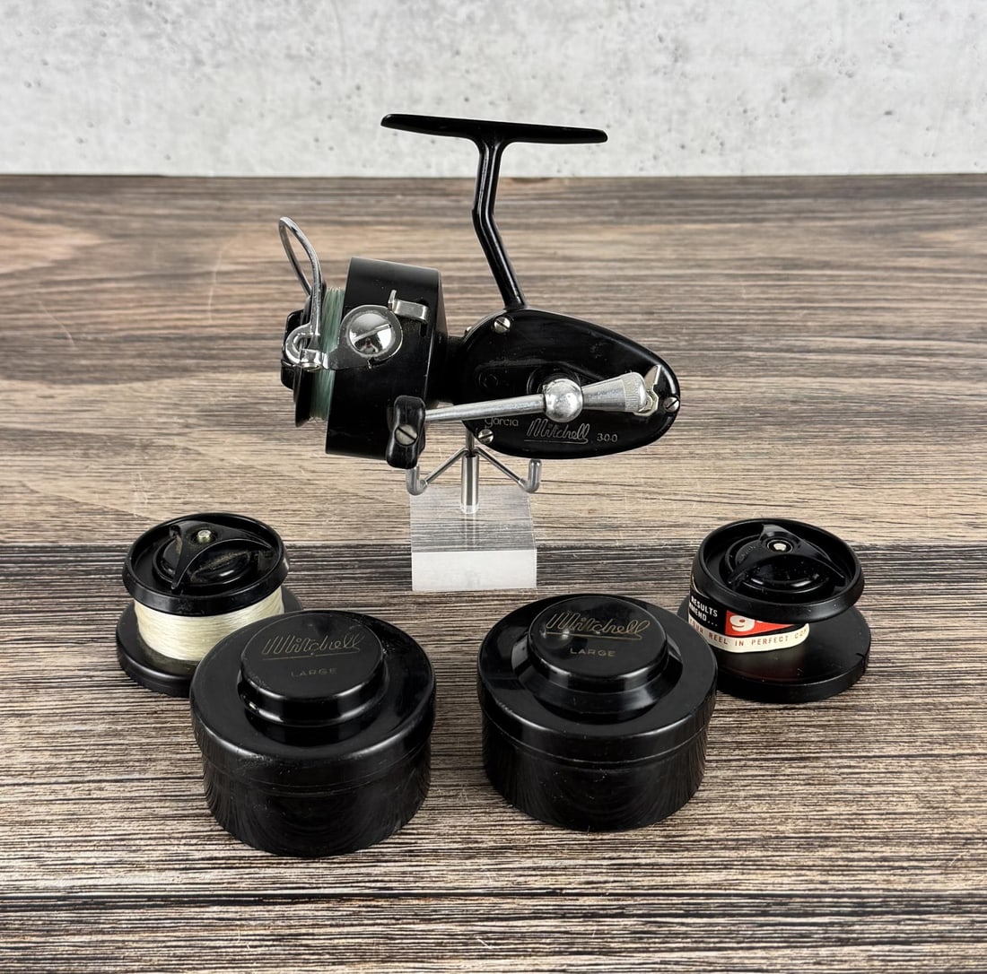 Garcia Mitchell 300 Spinning Fishing Reel: Two extra spools & cases.