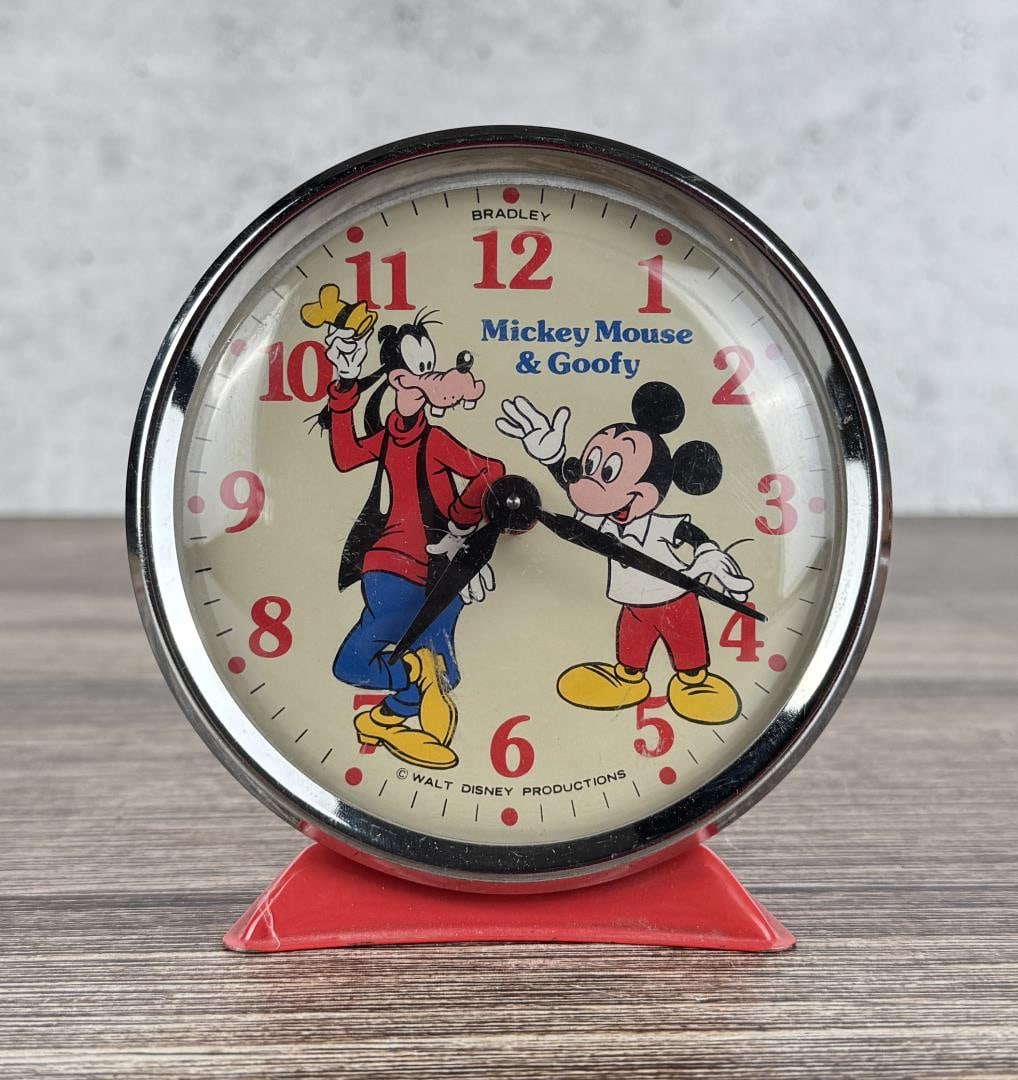 Walt Disney Mickey & Goofy Alarm Clock: In working condition. 4 3/8" by 4 1/4" by 2 3/4"