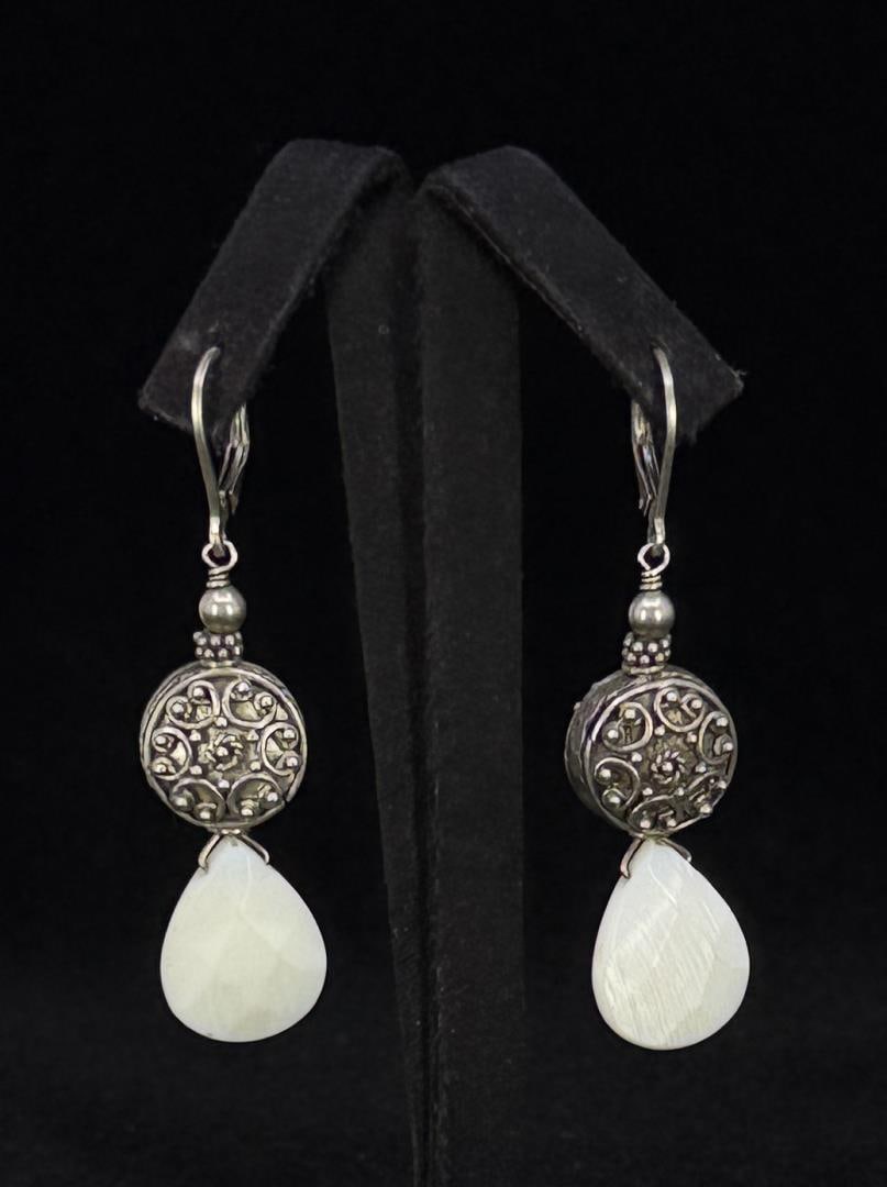 Sterling Silver Mother of Pearl Earrings: 11.42 grams. 2 1/8" long.