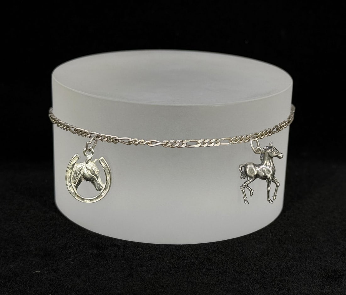 Sterling Silver Horse Charm Bracelet: 6.45 grams. 7 1/8" long open.
