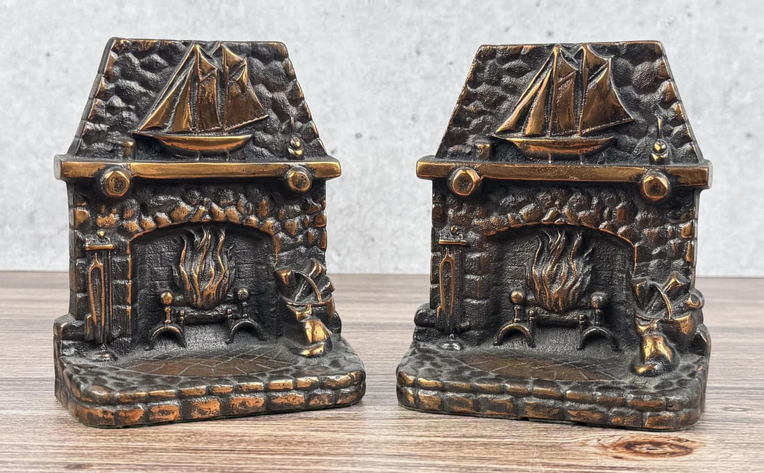 1935 Home's Hearth Bronze Bookends: 5 5/8" by 4 7/8" by 2 1/2".