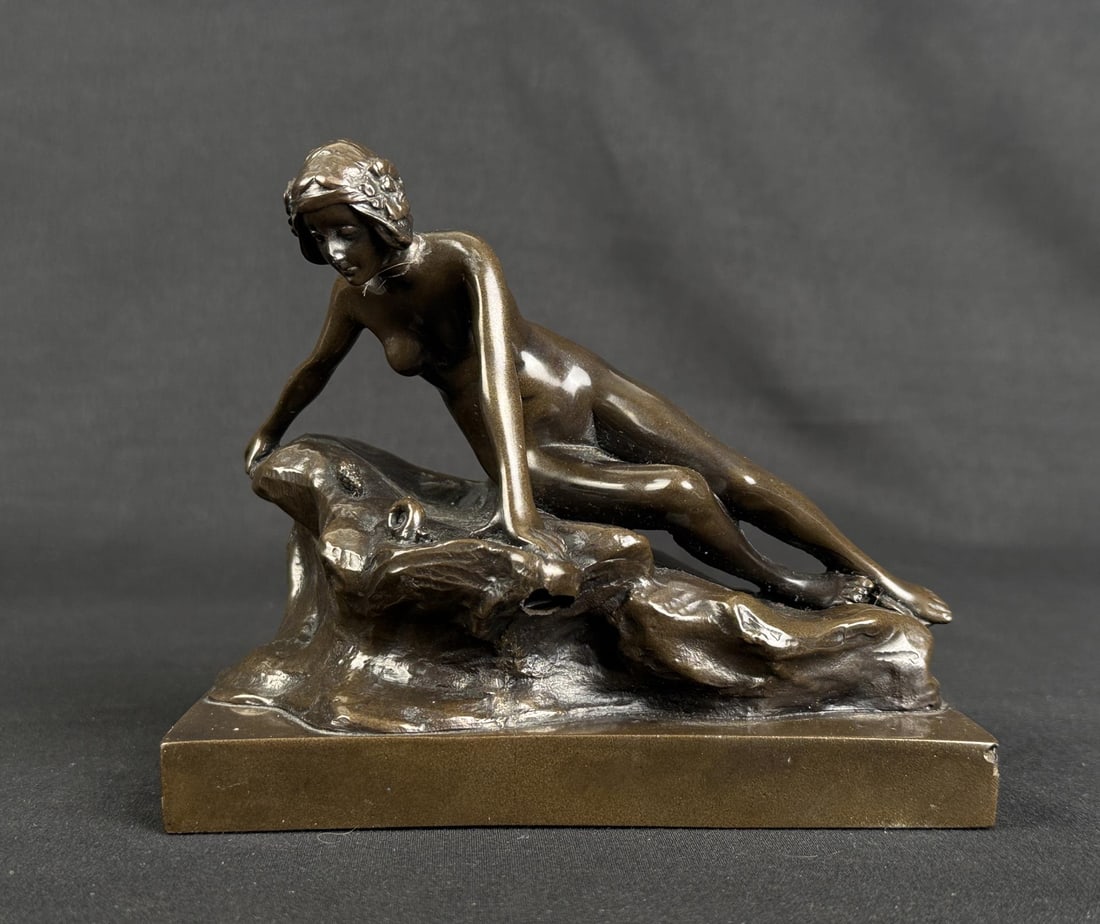 Art Deco Nude on Rocks Doorstop: 5 1/2" by 4 1/2" by 3 1/2". Bronze Clad. Neck is damaged and repaired.