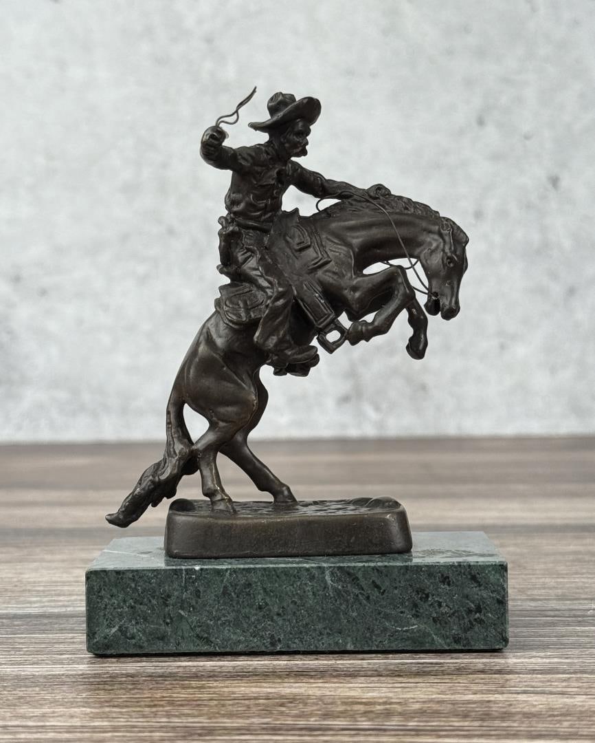 Frederic Remington The Bronco Buster Bronze: Title is The Bronco Buster. 4 5/8" by 3 1/2" by 2 1/8" Frederic Sackrider Remington (1861 - 1909) was active/lived in New York, Kansas, Connecticut. Frederic Remington is known for Western painting an