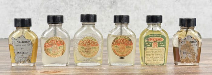 Group of Fishing Reel & Dry Fly Oil Bottles