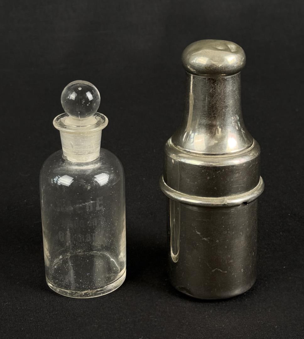 French Travel Perfume Bottle in Case: Bottle reads Haege Made In Germany. 4 1/8" tall by 1 1/2" in diameter.