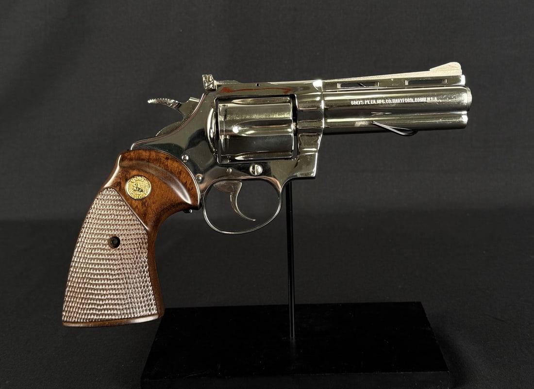 1976 Colt Diamondback .38 SPL Nickel Revolver: 4" having vent rib with pinned, ramped serrated blade front sight plus full under lug. Frame mounted nickeled Colt Accro rear sight. Mfg. 1976 (1966-1991) as smaller version of Python "Snake" revolver
