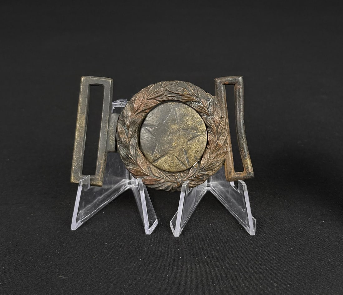 Civil War Confederate Texas Star Belt Buckle: Wreath Dug at Fort Graham Texas, Tongue dug at Spotsylvania Virginia. 3 1/2" by 2 1/4". Provenance: EX-Texas Civil War Museum, Fort Worth TX. Texas Civil War Artifacts: A Photographic Guide to the Phy