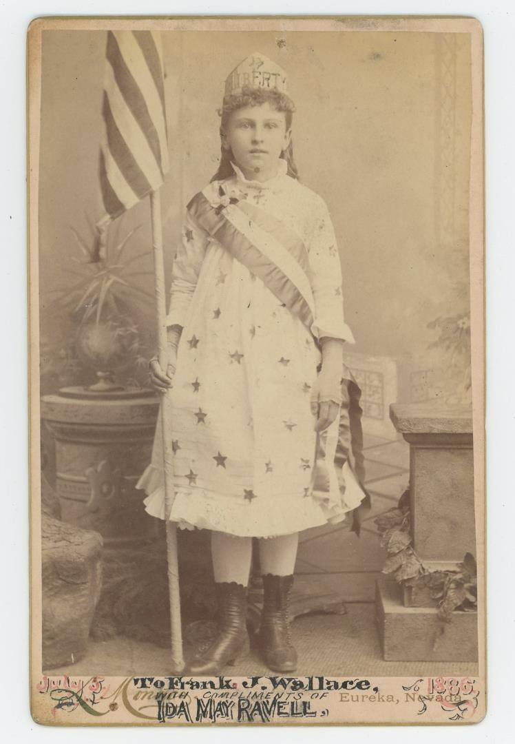 Eureka Nevada Mining Town 4th of July Photo: July 5th, 1886. Eureka, Nevada. Depicting a young girl named Ida May Ravell portraying Lady Liberty. 4" by 6". From the Ralph Merry Collection of Historic Photography.