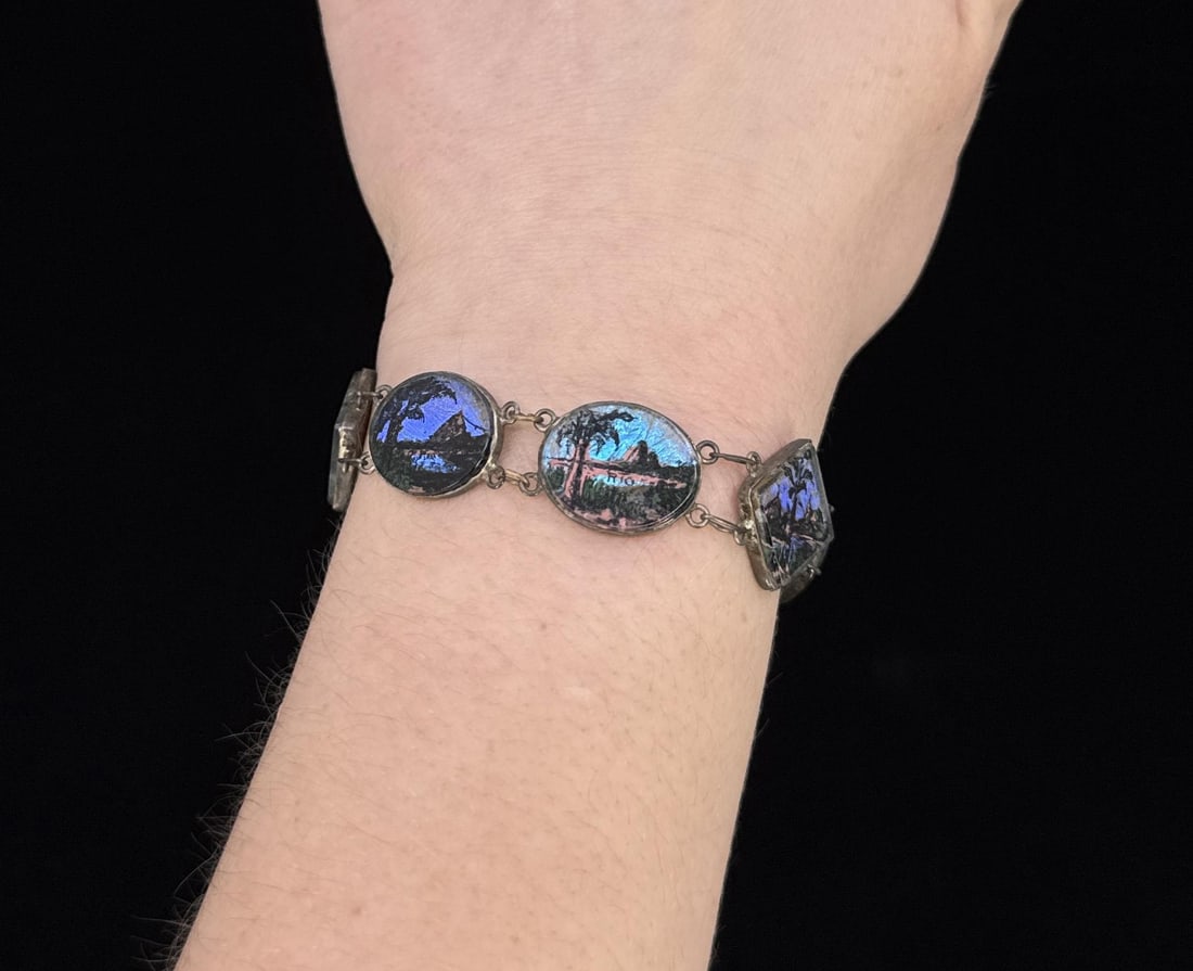 Blue Morpho Silver Butterfly Wing Bracelet: .900 silver. Weighs 12.52 grams. Measures 7" long.