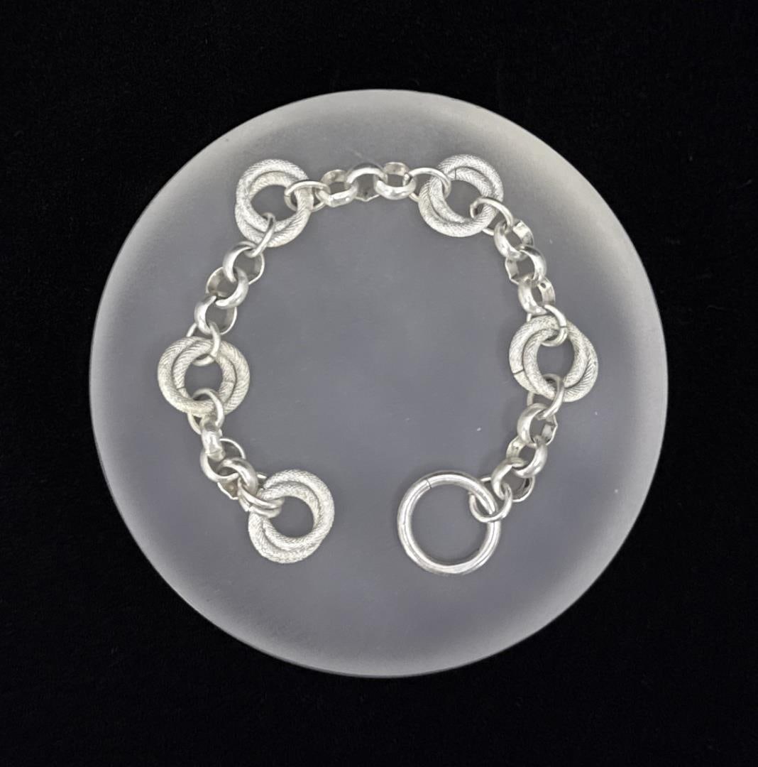 Sterling Silver Halo Chain Bracelet: Measures 6 5/8" long. Weighs 16.45 grams.