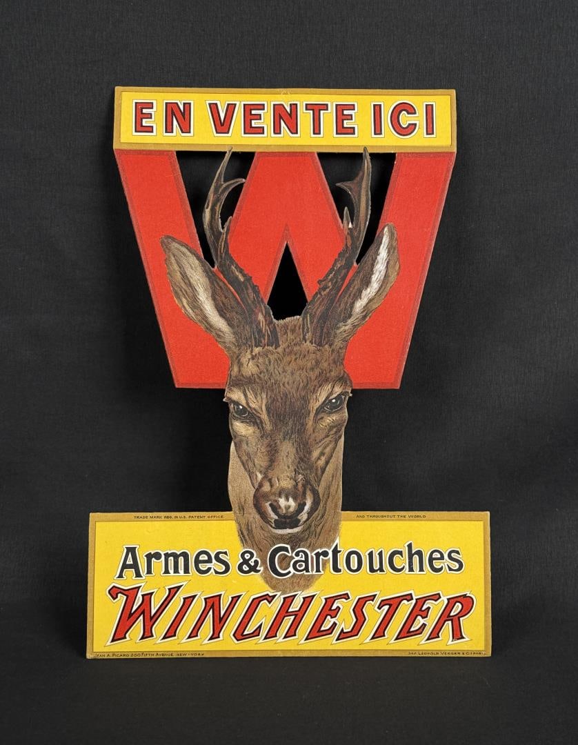 French Winchester Die Cut Store Display Sign: Scarce original French dealer cardboard advertisement. Distributed by J.M. Leguay & Cie, Paris France. 8 1/4" by 12 1/8"