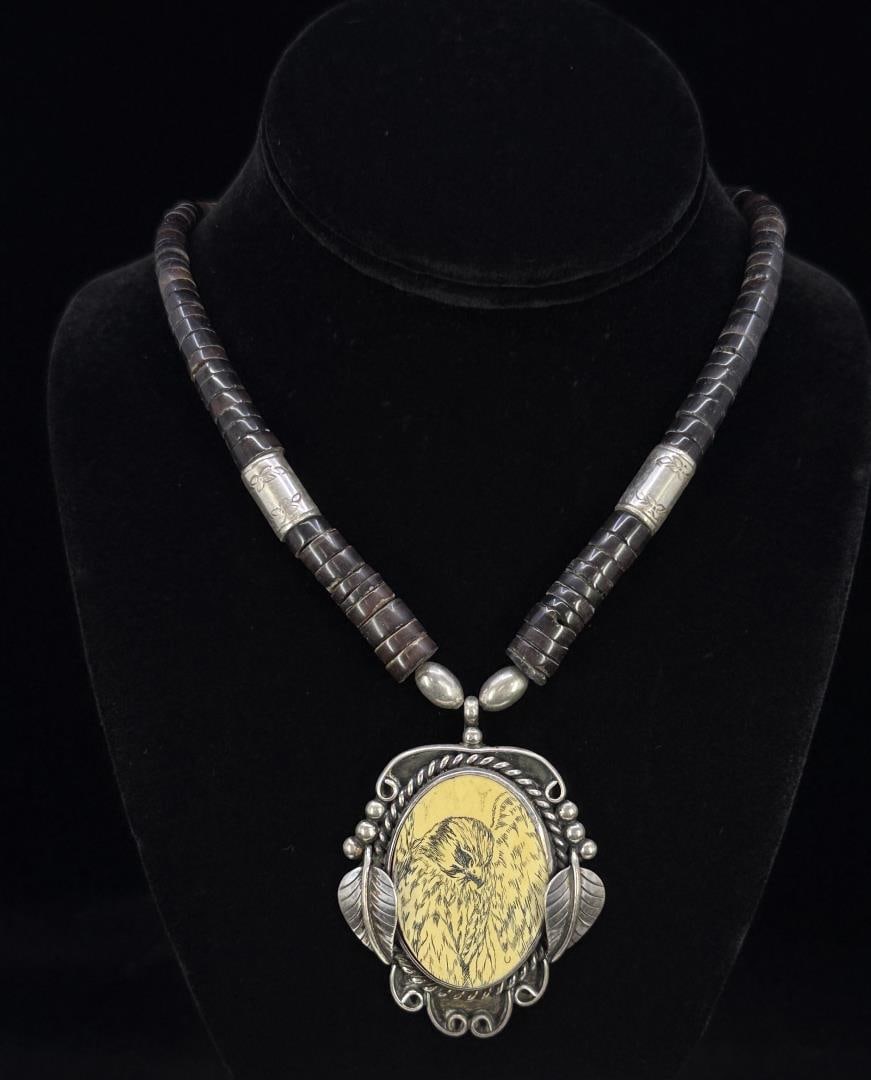 Navajo Sterling Silver Heishi Scrimshaw Necklace: 11 1/4" closed. Pendant is 1 7/8" wide. 53 grams total weight.