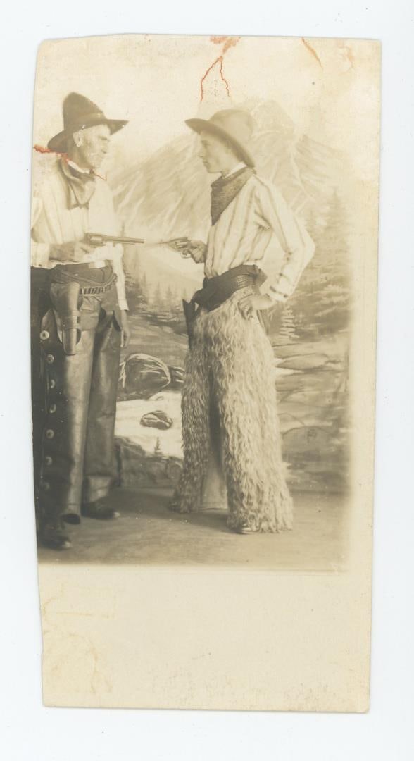 Cowboys in Staged Gunfight RPPC Photo Postcard: Nice image.