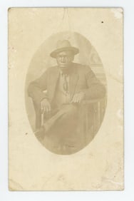 African American Man in Stickley Chair Postcard