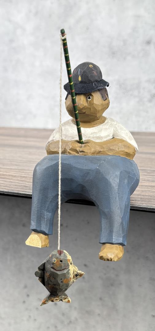 Larry Koosed Wood Carved Fisherman: 6 7/8" by 5 7/8" by 3 7/8". 1990. Signed underneath.