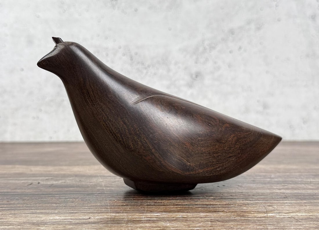 Mexican Ironwood Quail Carving: 6 7/8" by 3 7/8" by 2 7/8". Chipped piece on the head as shown.