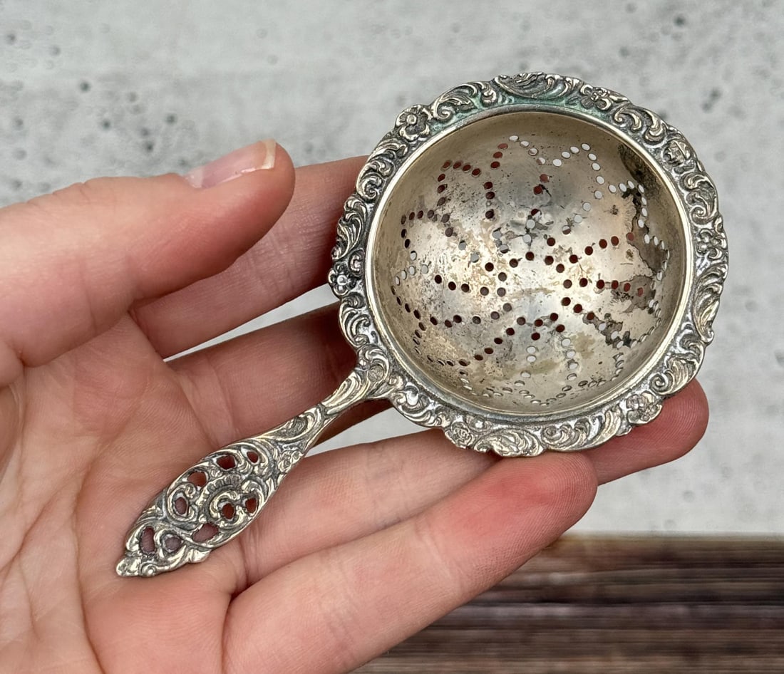 Georgian Repousse Silver Tea Strainer: 3 7/8" by 2 1/4" by 7/8". 22.50 grams. Repousse hallmark reads V.B.