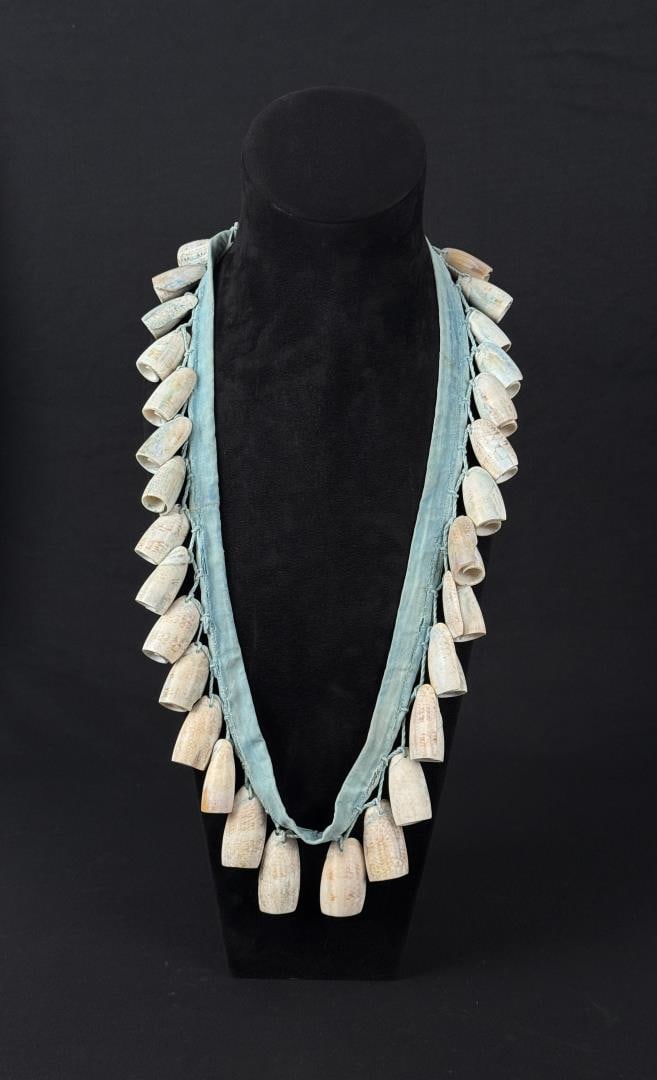 Pueblo Native American Olive Shell Bandolier: 21 1/4" long as displayed.