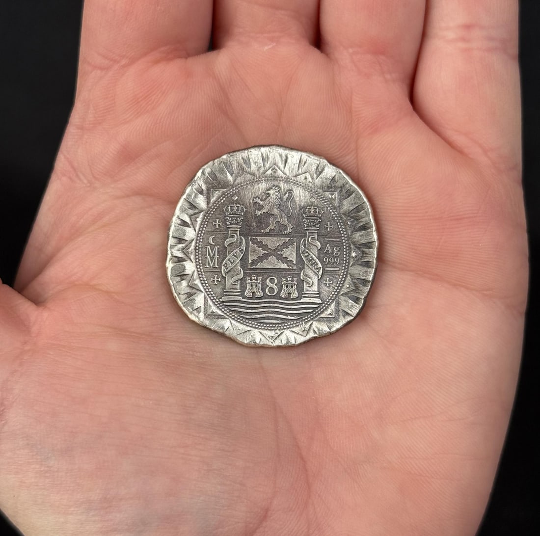 1622 Atocha 8 Reales Cobb Silver Round: Modern commemorative 1622 Atocha Silver Cob round, designed by Daniel Carr and struck by the Moonlight Mint, which contains trace amounts of silver recovered from the actual 1622 shipwreck.