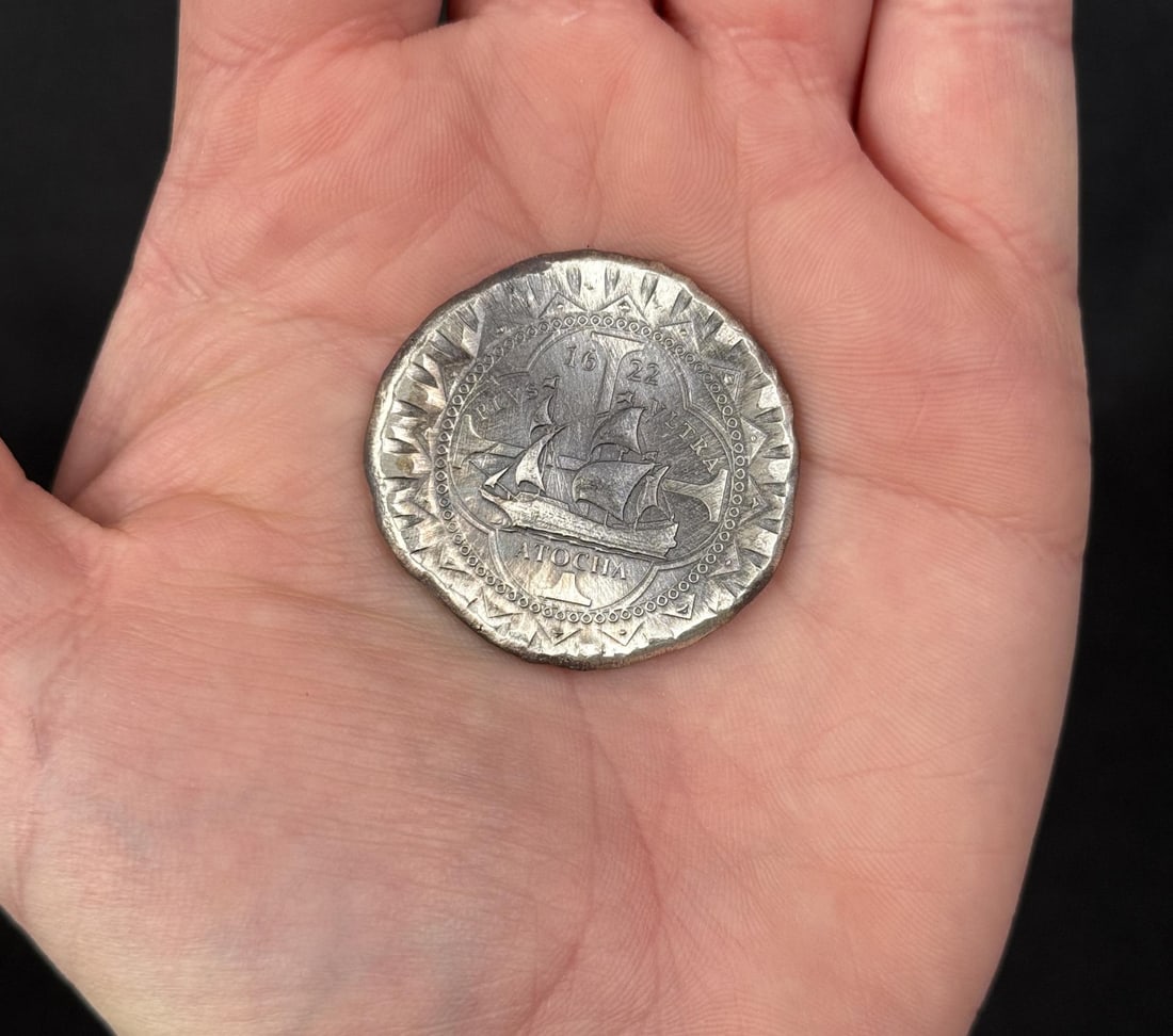 1622 Atocha 8 Reales Cobb Silver Round: Modern commemorative 1622 Atocha Silver Cob round, designed by Daniel Carr and struck by the Moonlight Mint, which contains trace amounts of silver recovered from the actual 1622 shipwreck.