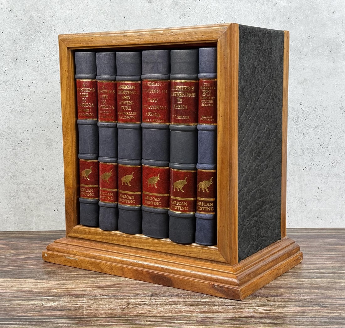 African Hunting Reprint Series 6 Volume Set: An elaborately boxed set of six hardcover books, all reprinted for the African Hunting Reprint Series c.1980-1982 by Books of Zimbabwe and housed within a lovely wooden bookshelf. Each book was report