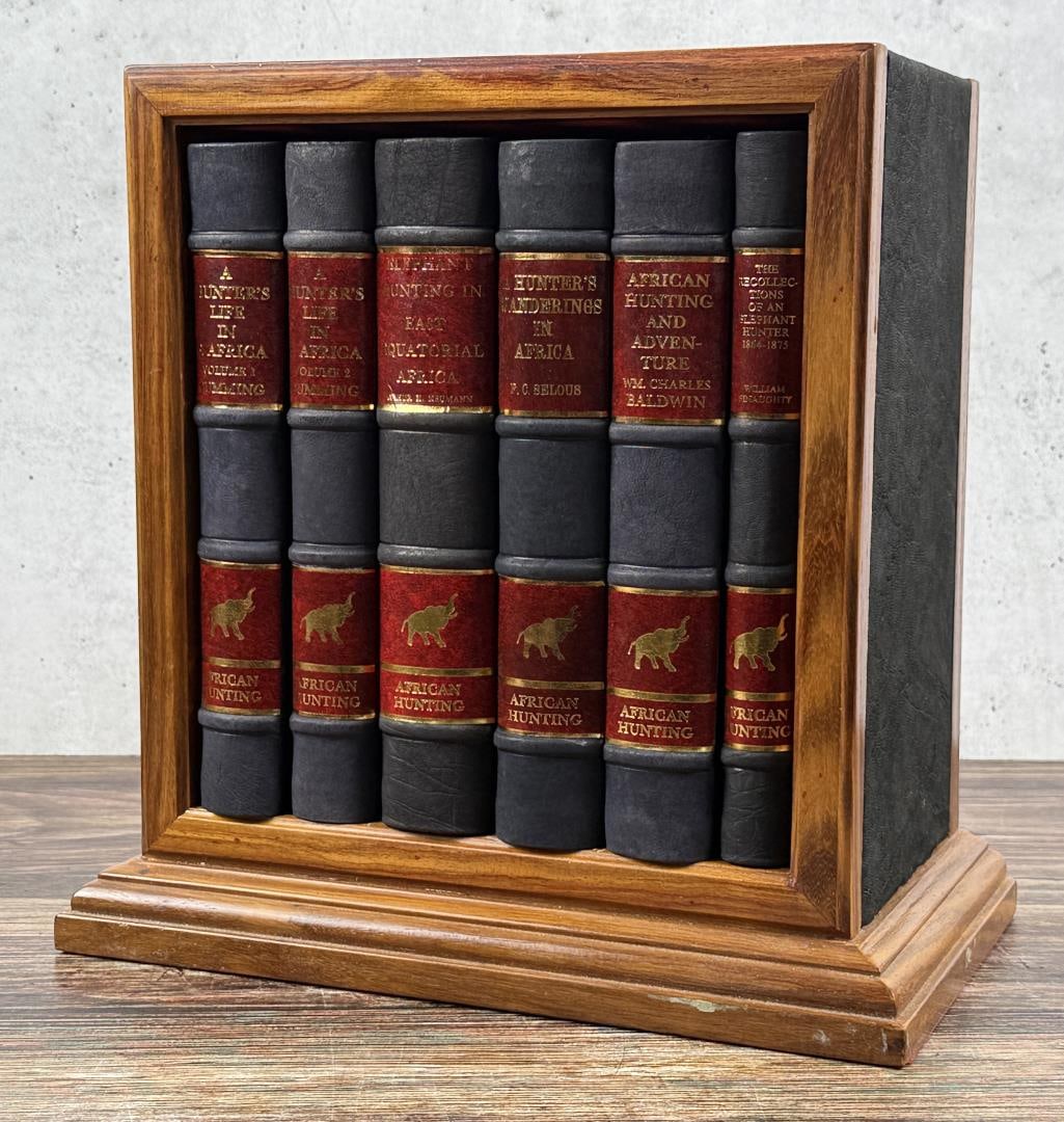 African Hunting Reprint Series 6 Volume Set: An elaborately boxed set of six hardcover books, all reprinted for the African Hunting Reprint Series c.1980-1982 by Books of Zimbabwe and housed within a lovely wooden bookshelf. Each book was report