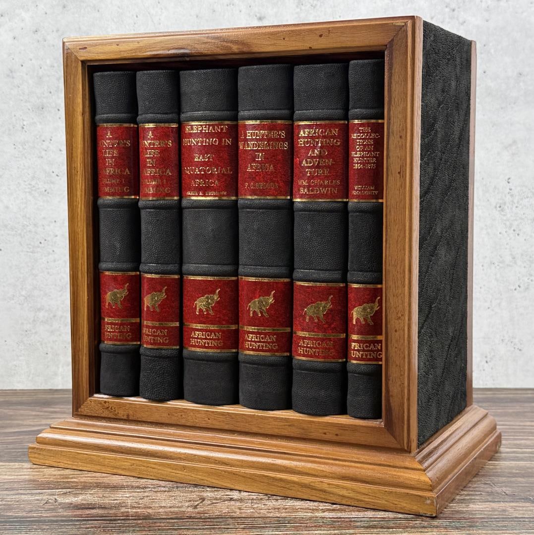 African Hunting Reprint Series 6 Volume Set: An elaborately boxed set of six hardcover books, all reprinted for the African Hunting Reprint Series c.1980-1982 by Books of Zimbabwe and housed within a lovely wooden bookshelf. Each book was report
