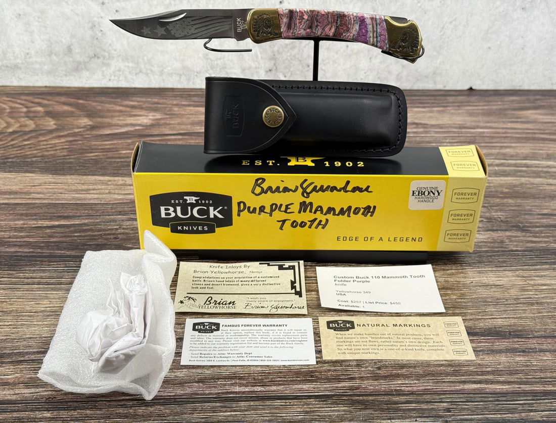 Buck 110 Custom Brian Yellowhorse Pocket Knife: Purple mammoth tooth handle. Satin finish 420HC stainless clip point blade. Has not been used or carried. Knife inlays by Navajo artist Brian Yellowhorse. 4 7/8" long closed.